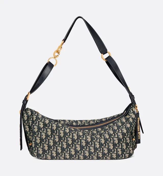 Patterned handbag with a black strap on a light gray background
